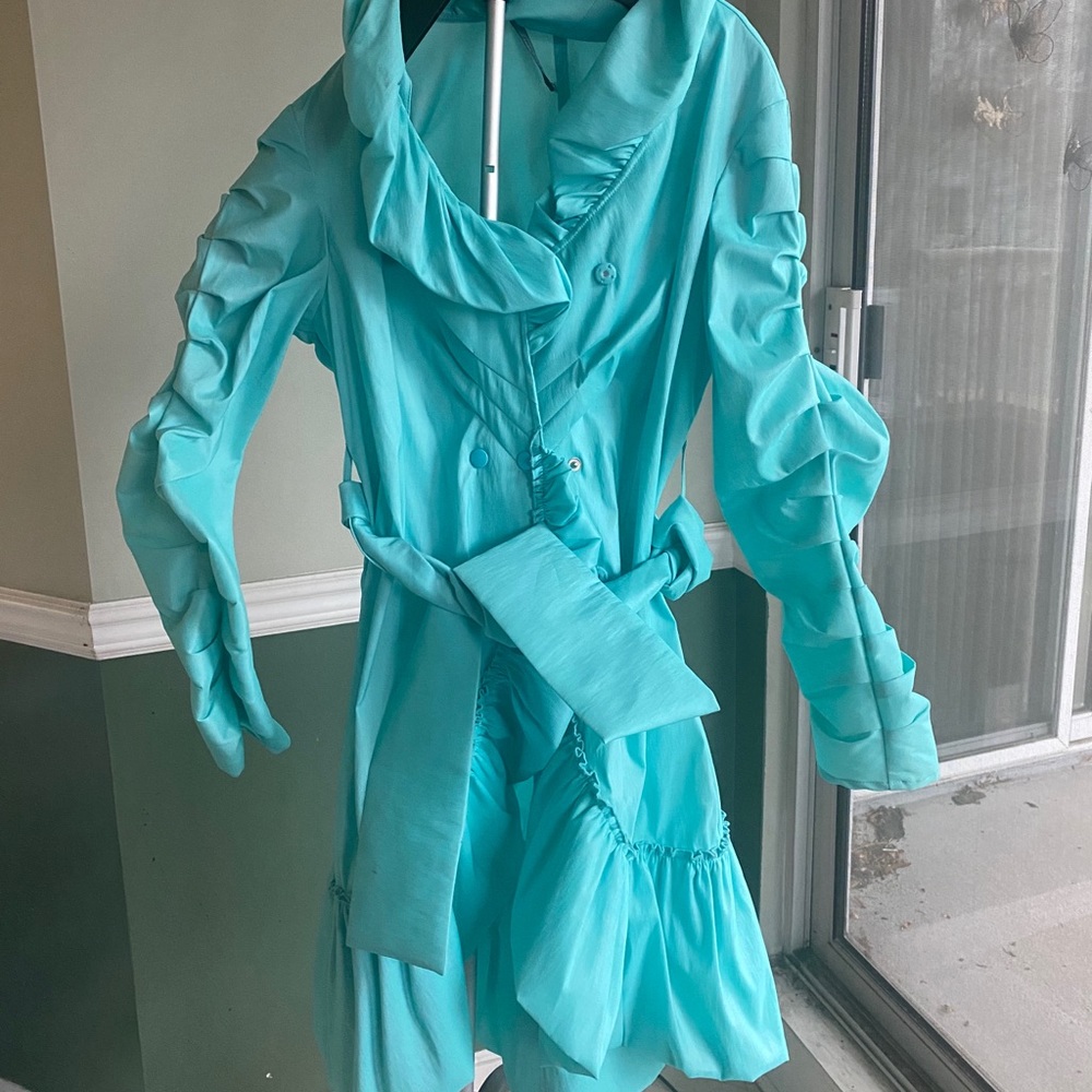 Light blue raincoat with ruffles